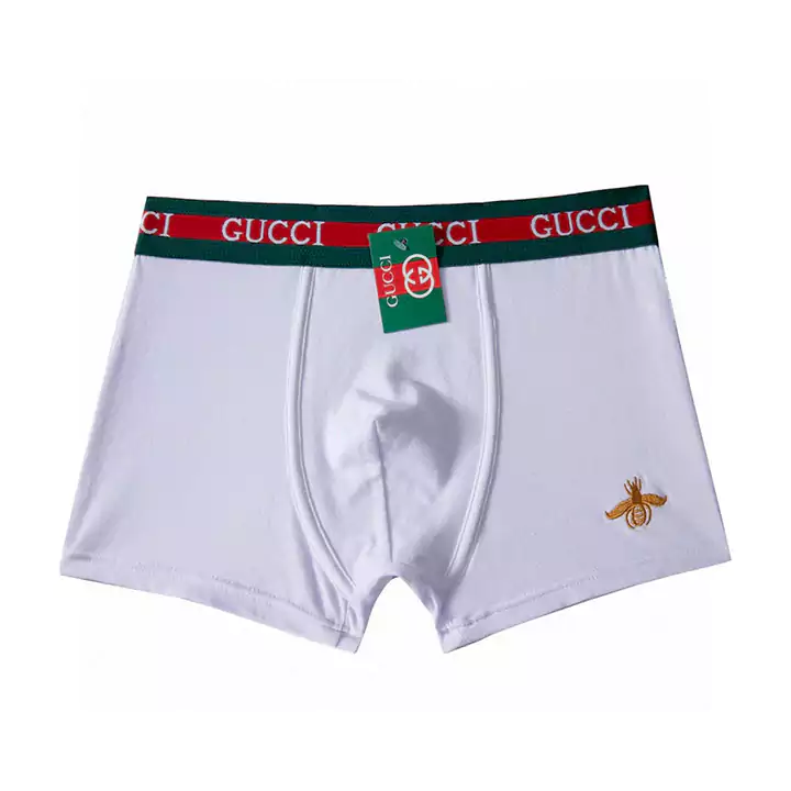 GUCCIボックス3枚組のボクサーパンツは、クラシックなカウンターボックスパンツで、純粋な綿素材で手触りが非常に良いです。ボールを起こさずに変形せず、通気性と吸湿性が非常に優れています。肌に優しく快適で、GUCCIロゴのパターンがフレームに沿ってデザインされています。ゴム入りのウエストバンドは緩みにくく、刺繍された小さなミツバチがあり、永遠のクラシックです。王者の選択肢であり、男性の魅力を完璧に表現し、雄々しさを演出します。